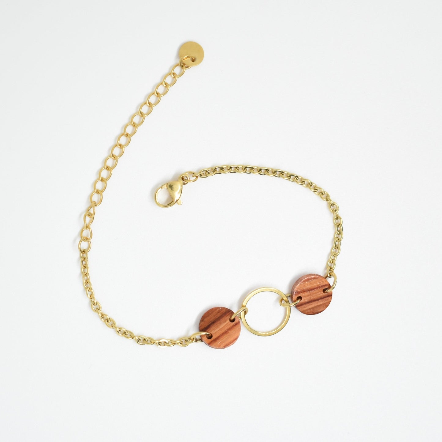 Bracelet rond femme doré en bois précieux et acier inoxydable. Fabrication artisanale en France par une ébéniste